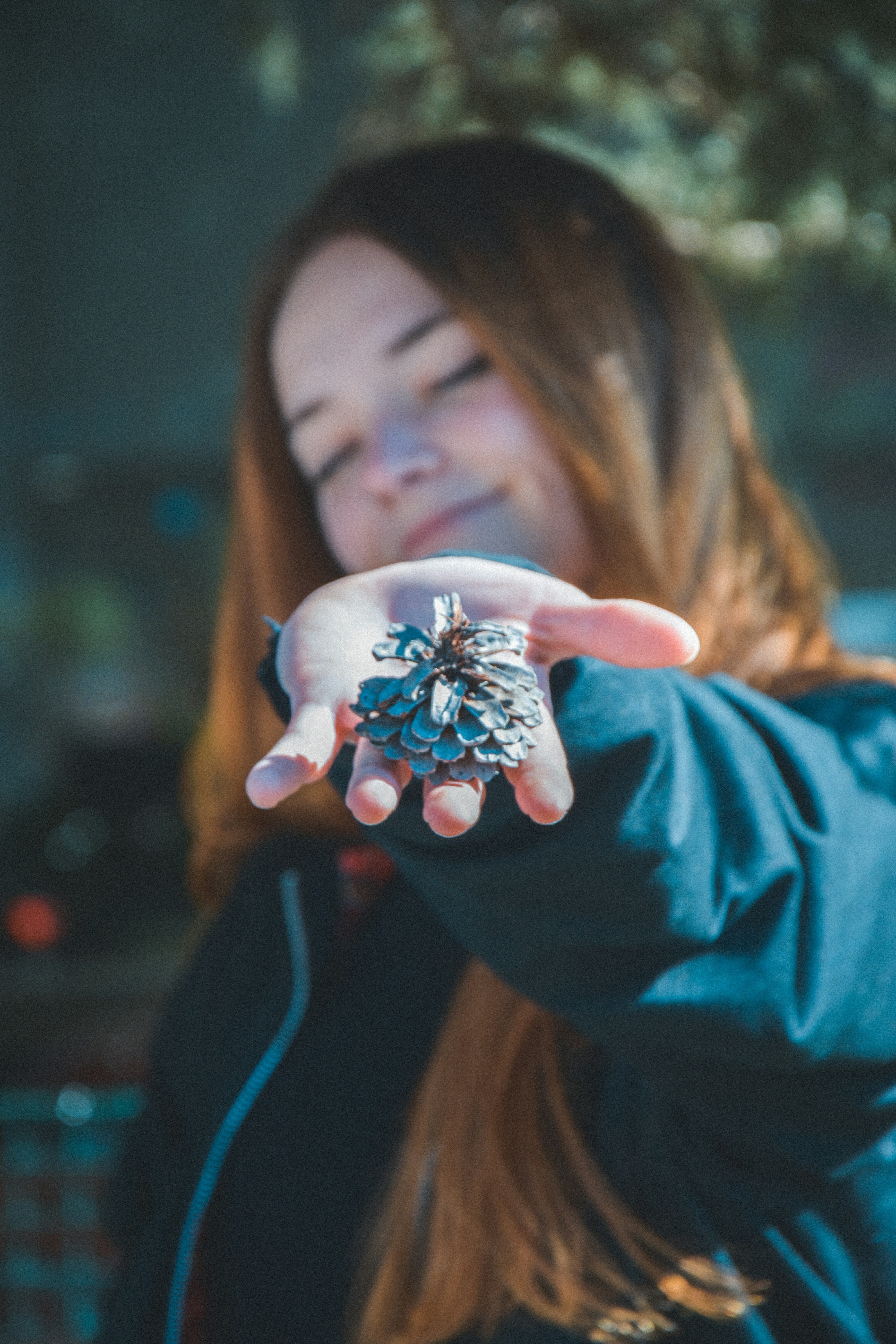 person holding leaf